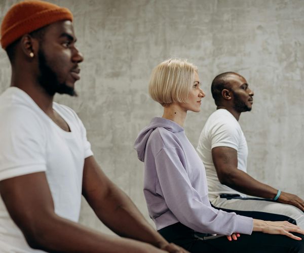 Diverse group of people of different ages practicing yoga together.
